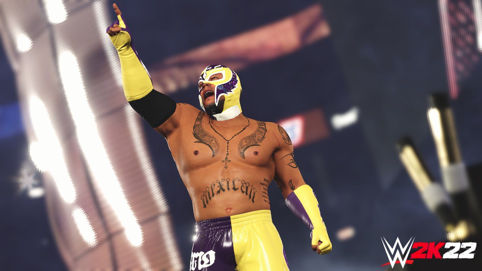 Rey Mysterio points upwards in a yellow mask and trunks in WWE 2K22.