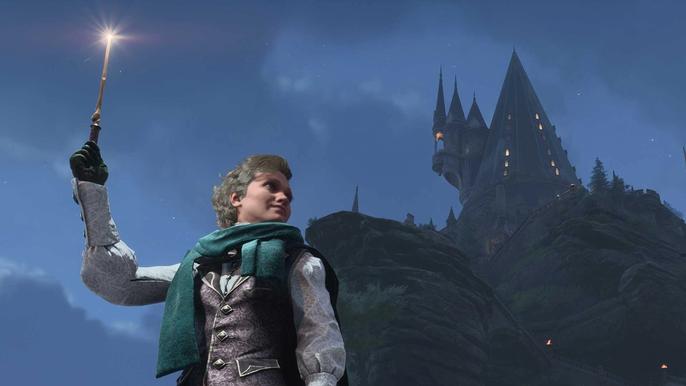 A witch casting a spell against the backdrop of the castle in Hogwarts Legacy.
