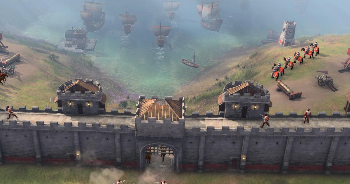 An Age of Empires 4 town surrounded by Stone Walls, Towers and Gates.