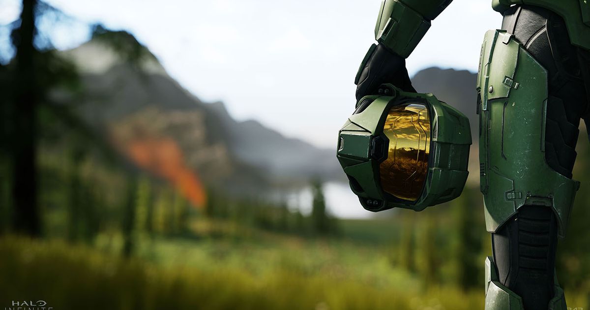 Master Chief holds his helmet by his side.