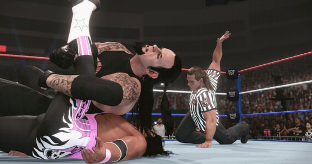 Two wrestlers battle it out as the referee counts them out in WWE 2K24