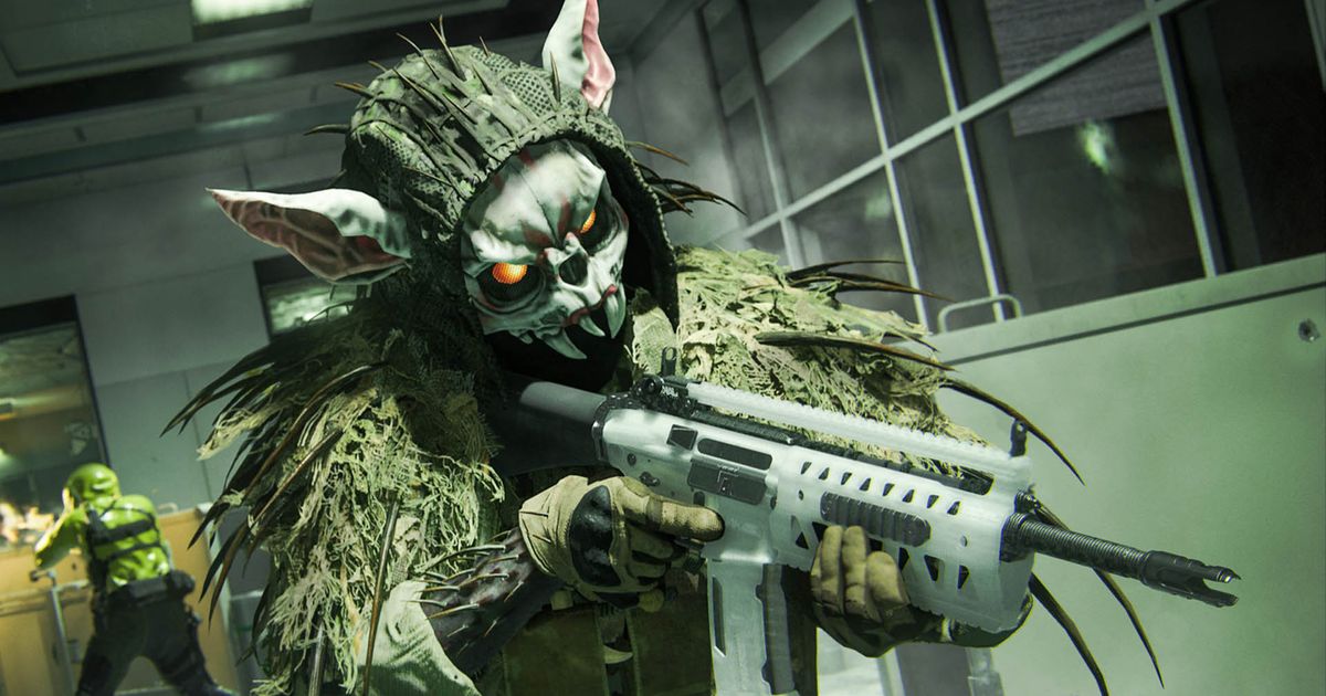 Warzone player holding SMG while wearing spooky rabbit mask