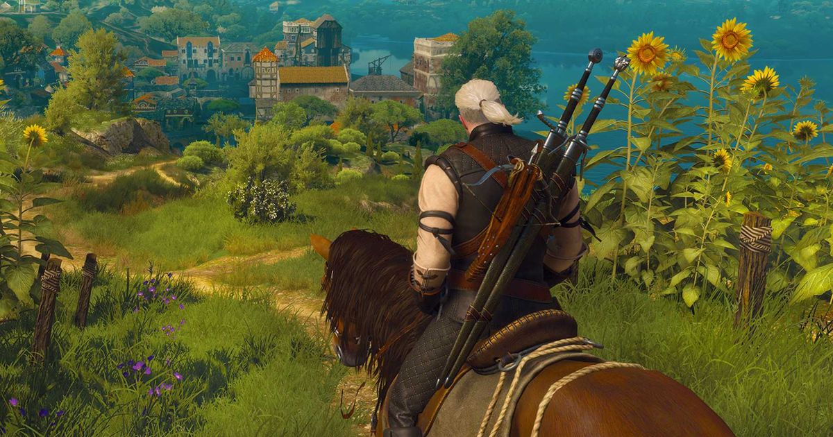 Geralt of Rivia riding across a green landscape in The Witcher 3.