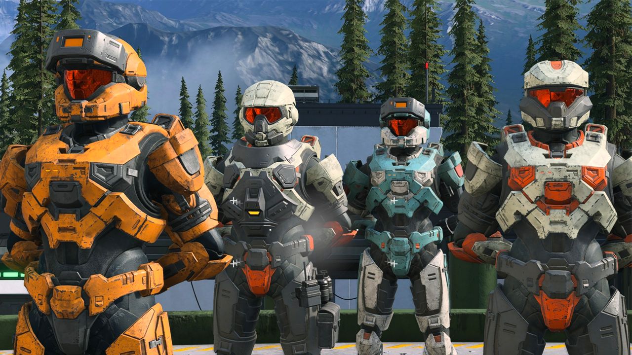 Four Spartans dressed in different colour armour: orange, grey, blue, and white.