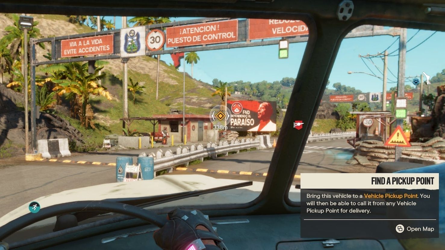 Driving a hijacked vehicle in Far Cry 6, which can be taken to any pick-up point for later use.