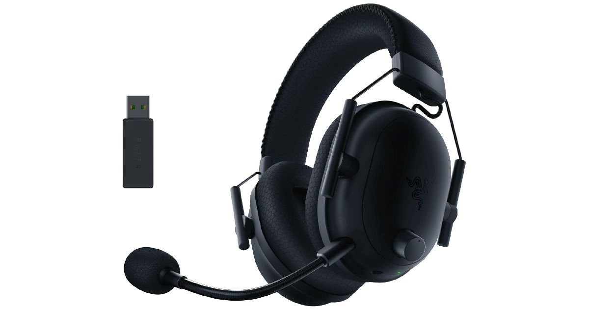 Razer BlackShark V2 Pro product image of an all-black over-ear headset featuring a mic that extends around to the front. The headset is also next to a USB dongle.