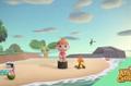 Using photo mode, a player is sat on a log stool on the beach in Animal Crossing: New Horizons.