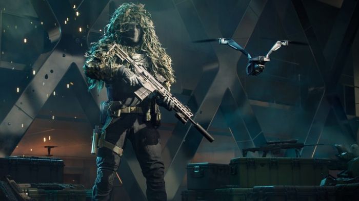 Another look at Casper holding a gun, while wearing a camouflaged suit. The drone is also to his right.