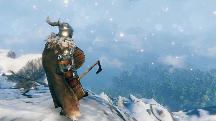 A player in a snowy mountain biome in Valheim.