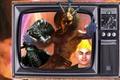 Dagoth Ur, The Dragonborn and The Adoring Fan from The Elder Scrolls in a retro-style TV