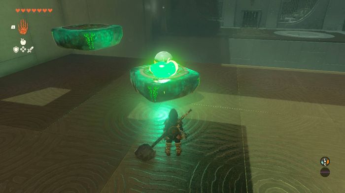 Link looking at a glowing ball in the Ihen-a Shrine in Zelda Tears of the Kingdom.