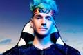 A profile shot of Ninja sitting on a gaming chair