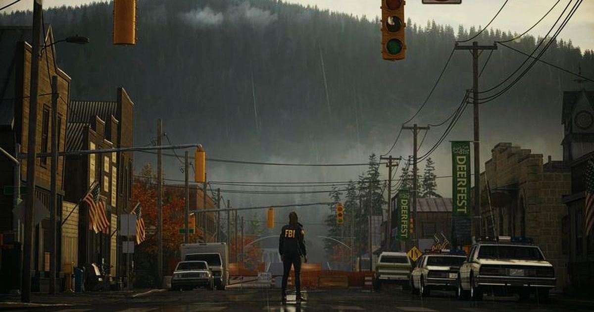 Alan Wake 2: woman in an FBI jacket stands in a road looking at a forested mountain in the distance