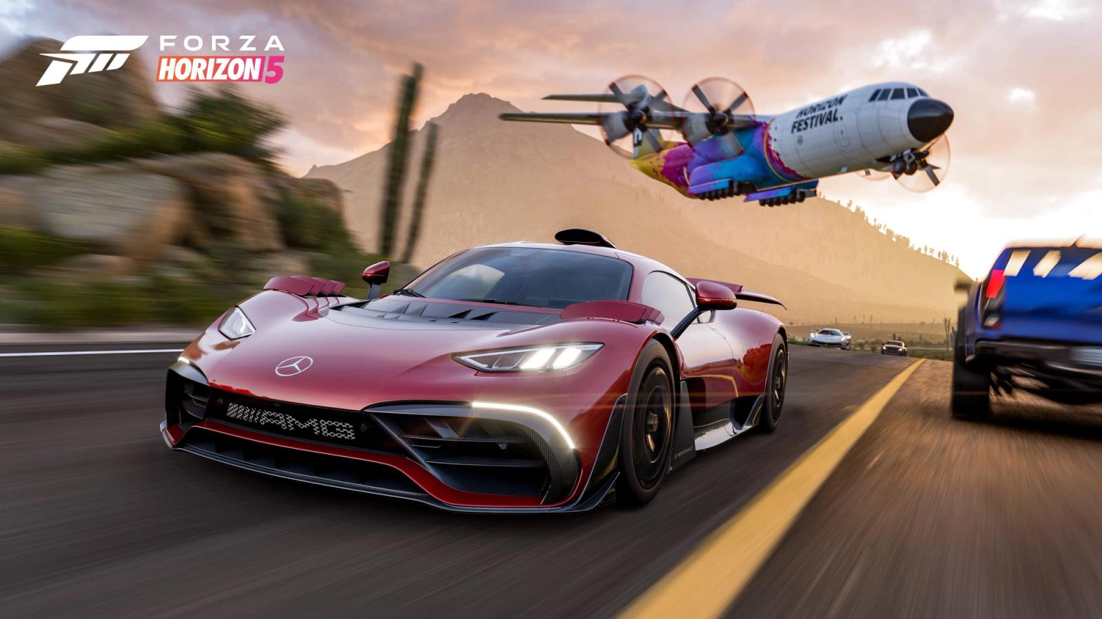 An AMG sports car races as a plane flies low in the background. The sides of the image include motion blur to indicate high speeds