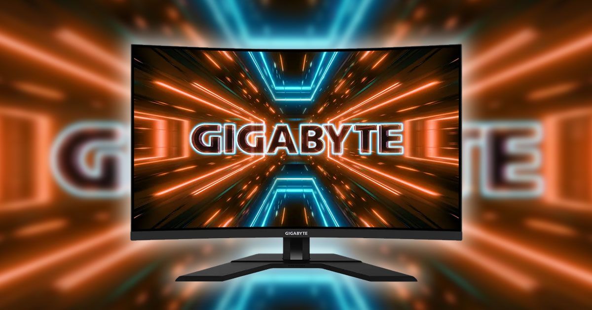 A black near-frameless monitor featuring Gigabyte branding in blue neon surrounded by orange neon lights on the display..