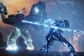 A character in Destiny 2 with a staff surrounded in blue light fighting a large enemy.