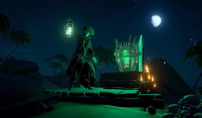 A pirate searching a beach at night in Sea of Thieves