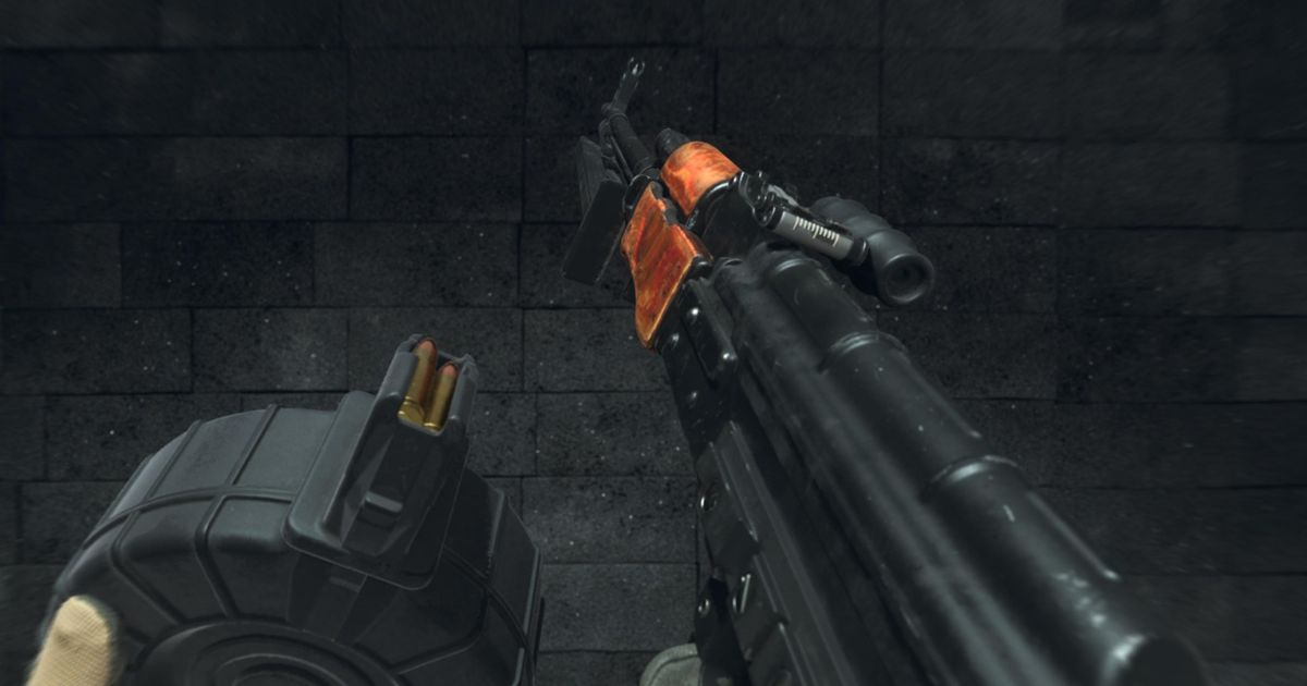 Modern Warfare 3 player holding RPK LMG with black wall in background