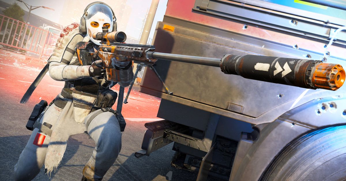 Warzone player aiming down sights of suppressed sniper rifle while crouching