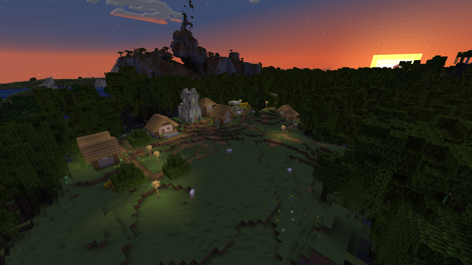 A Minecraft village, surrounded by swamp that looks very pretty in the sunset.