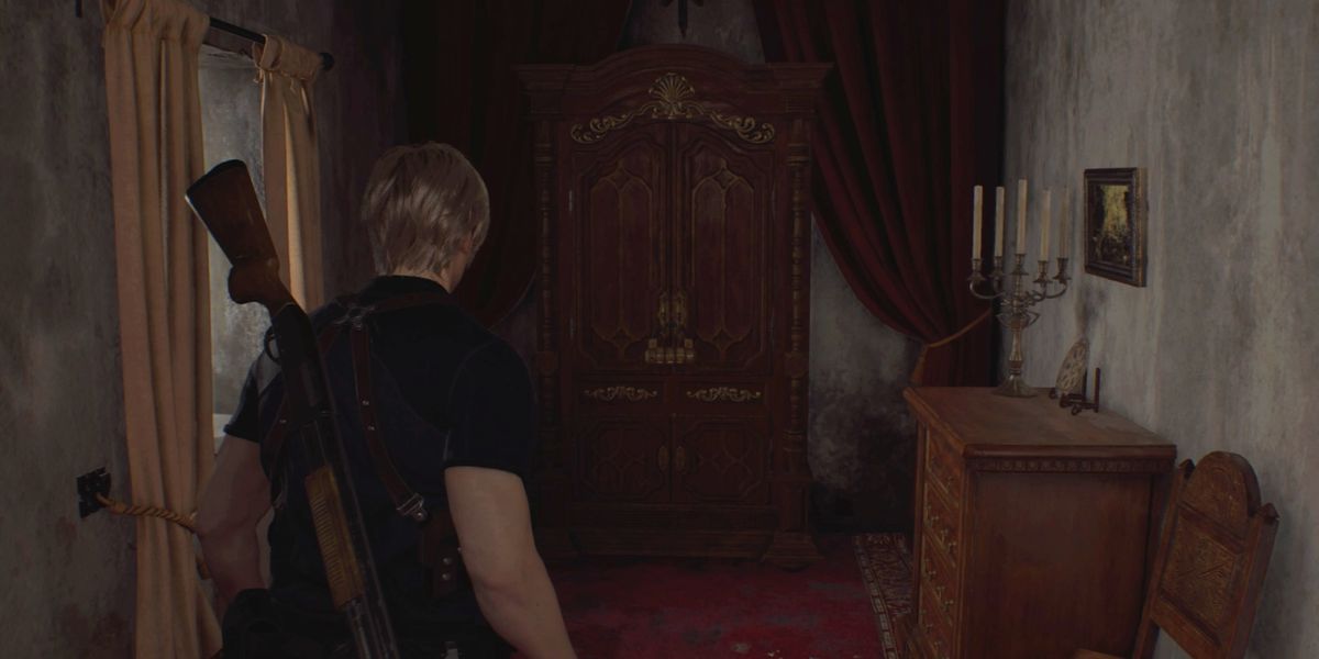 Leon facing the wardrobe in the Village Chief's manor in Resident Evil 4 remake