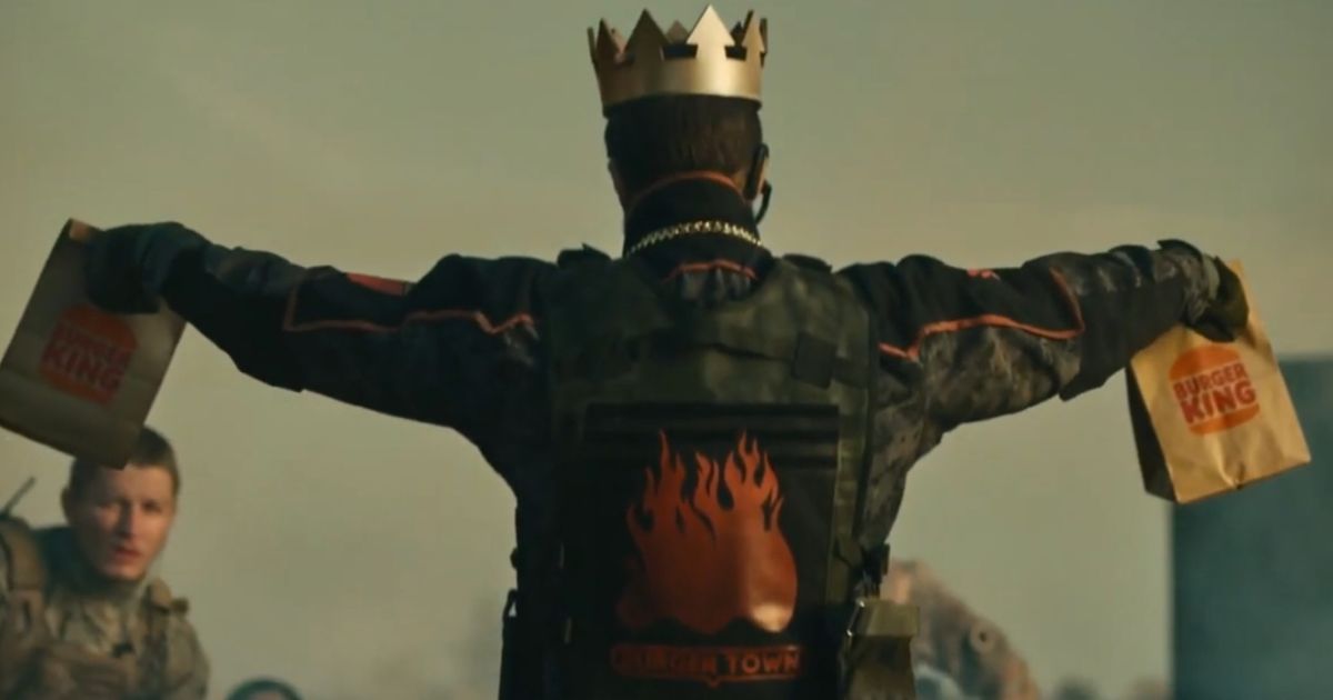 Modern Warfare 3 Burger King Operator wearing crown and holding brown bags with Burger King logo
