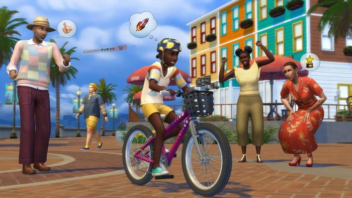 Townspeople walking around the town square, with one on a bike, in The Sims 4.
