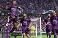 Football Manager 24: football players in purple jerseys celebrate scoring a goal