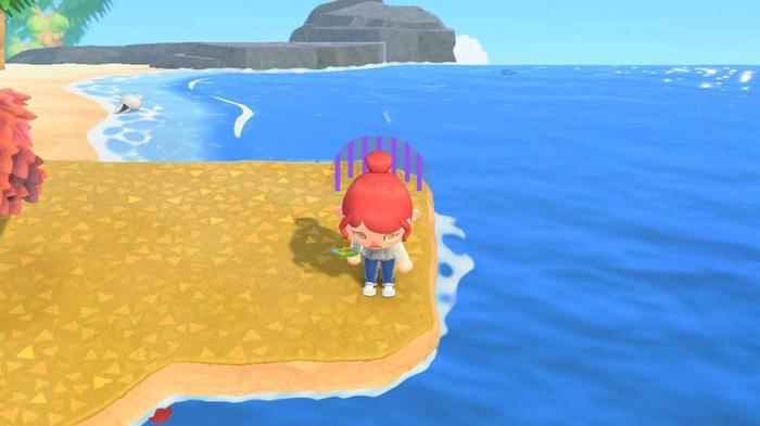 Animal Crossing New Horizons. The player is expressing sadness after dropping their balloon gift in the water.