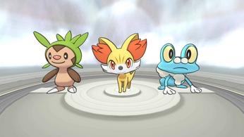 Three Pokémon are standing next to each other on a stage