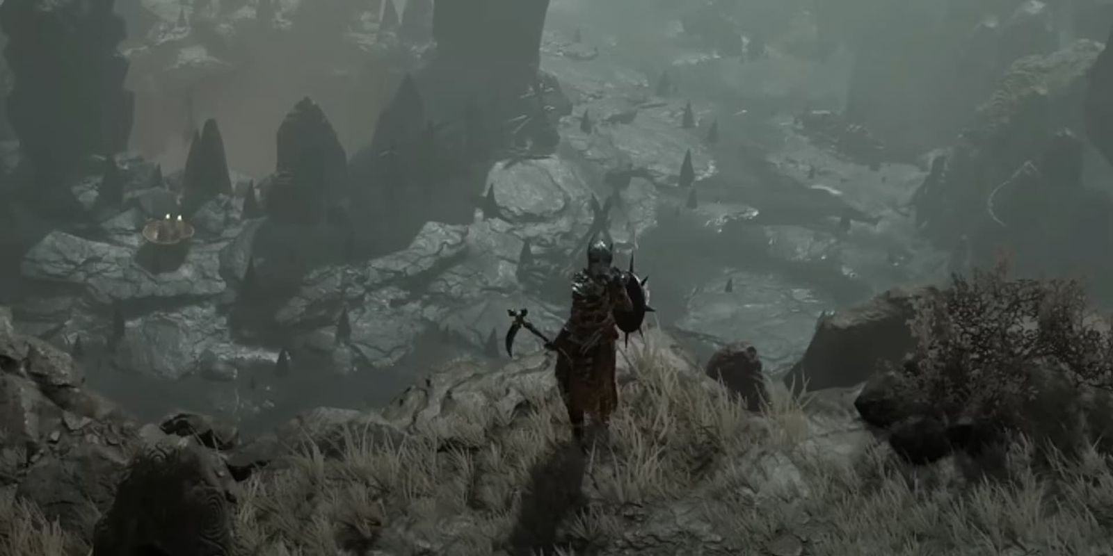 A Diablo 4 character looking over a cliff's edge.