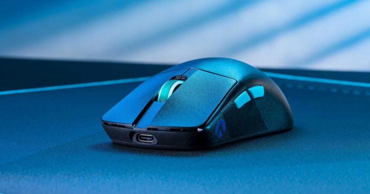 A black wireless gaming mouse bathed in blue light.