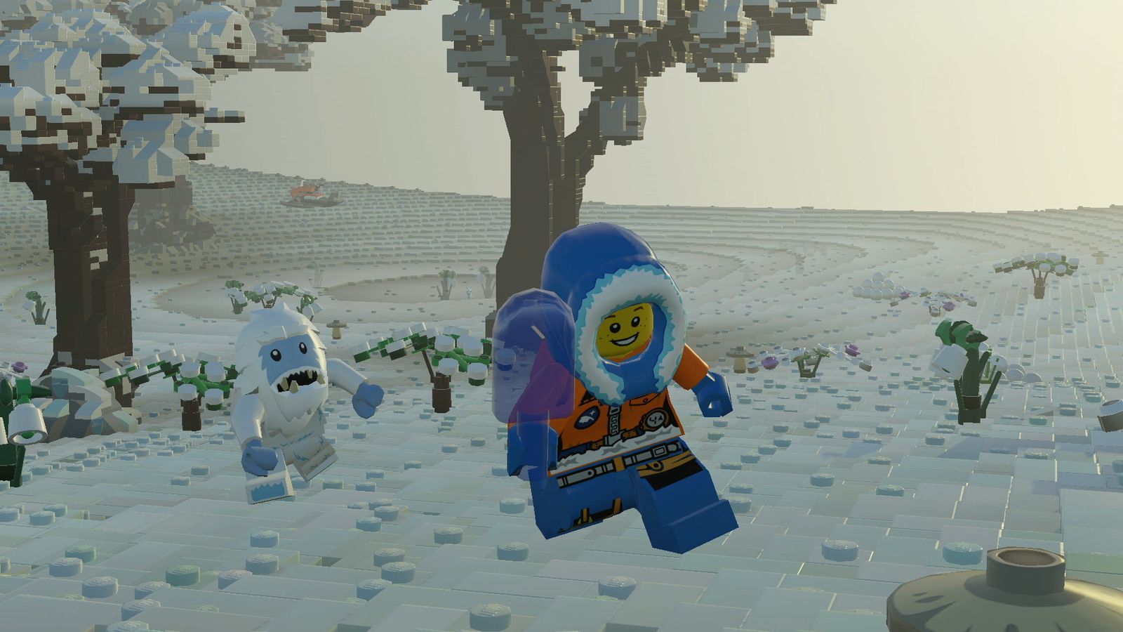 In-game image from LEGO Worlds of a LEGO character wearing a blue hood and orange clothing running from a snowy monster in a snowy landscape.