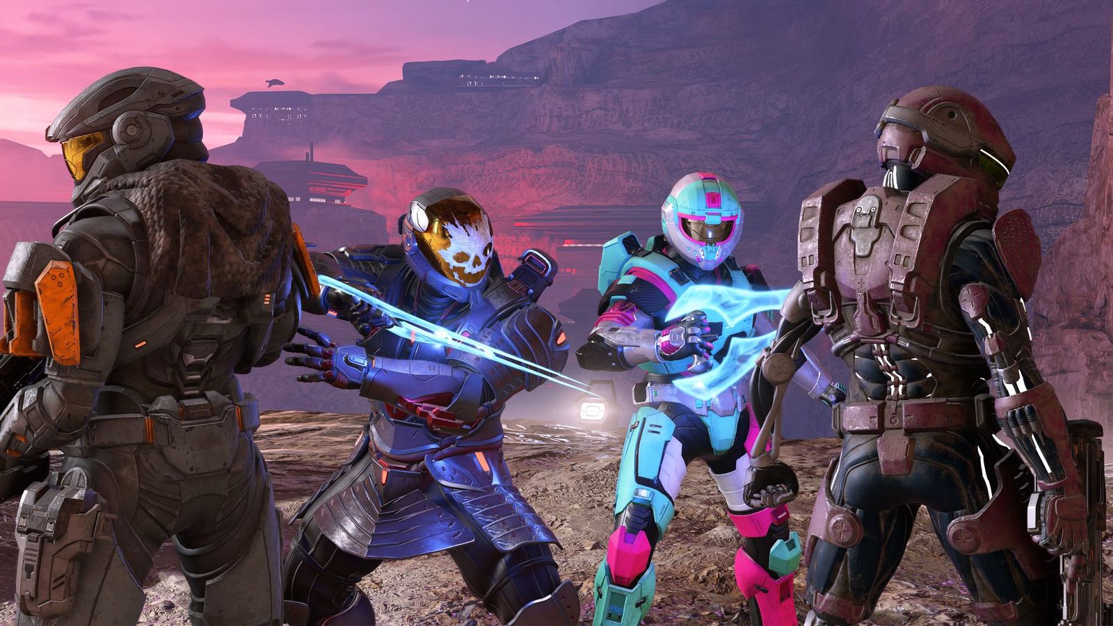 Four Halo Spartans posing, the two in the middle baring energy swords 