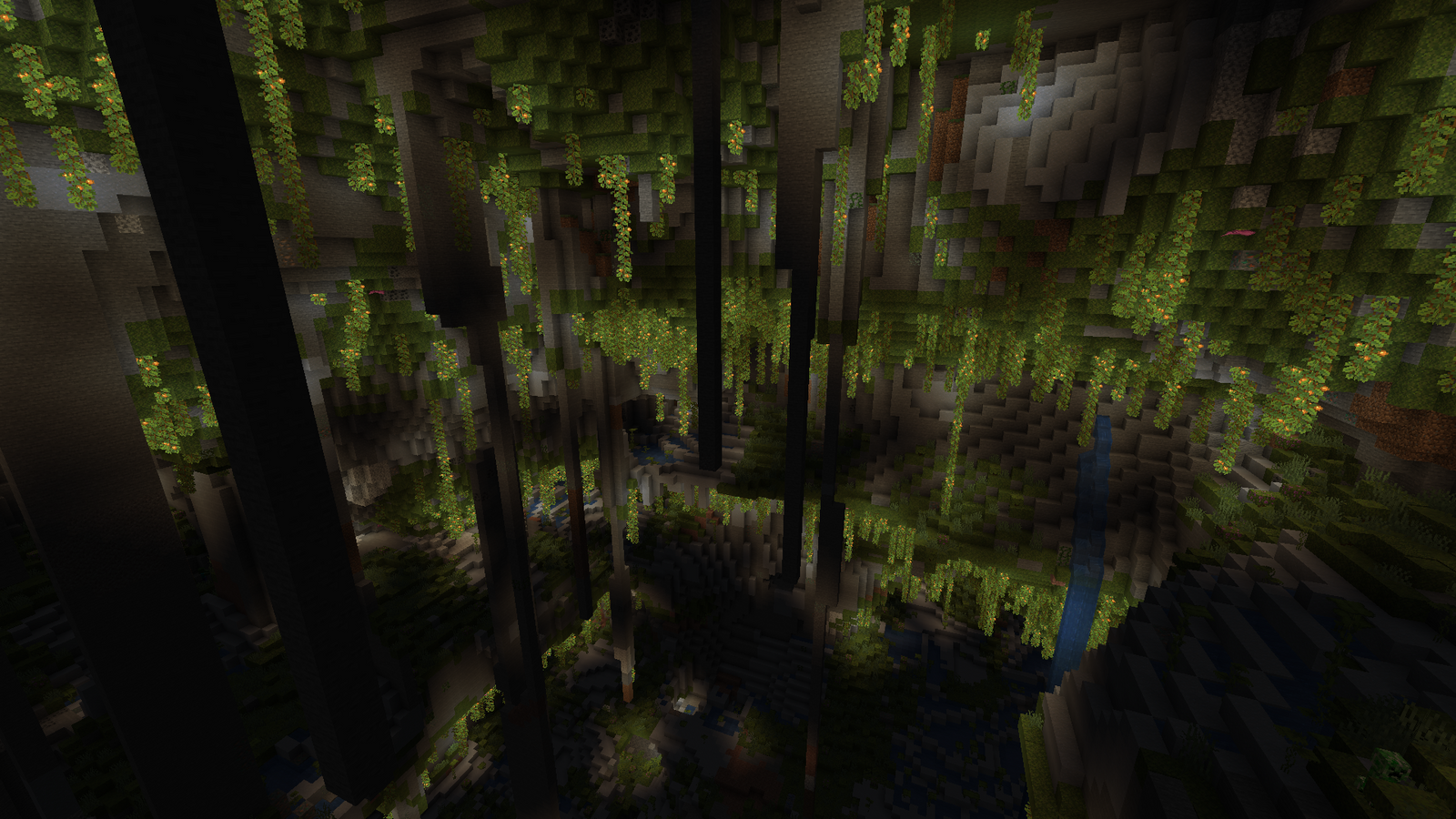 A huge Minecraft cave, lit up by berries.