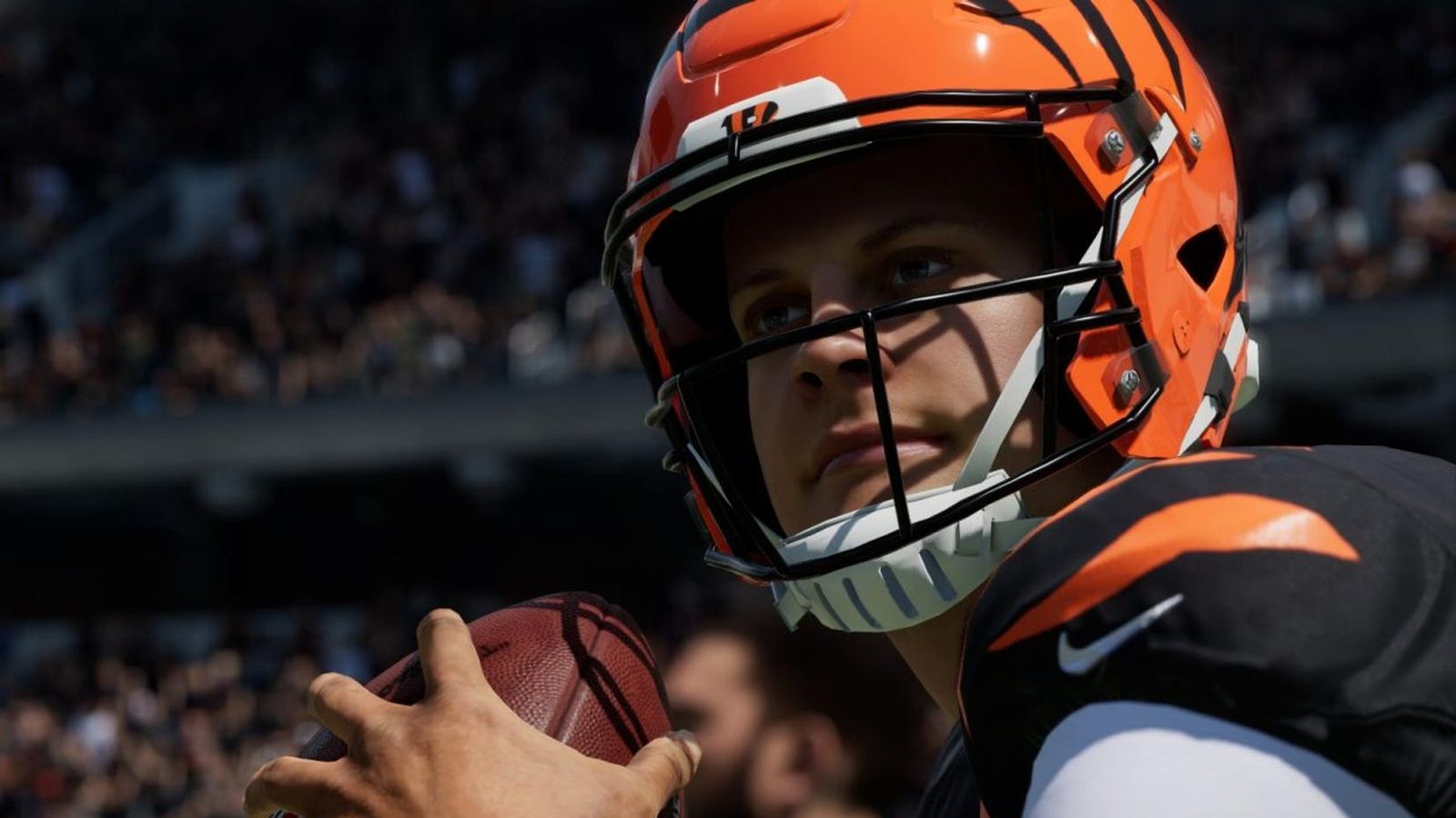Image showing NFL player holding football in Madden 23
