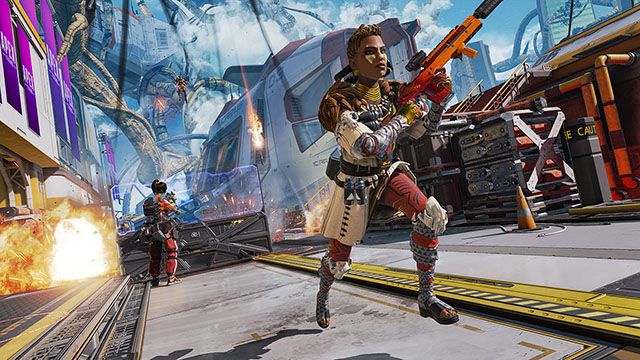 Screenshot of Apex Legends player holding gun and another player holding gun behind shield
