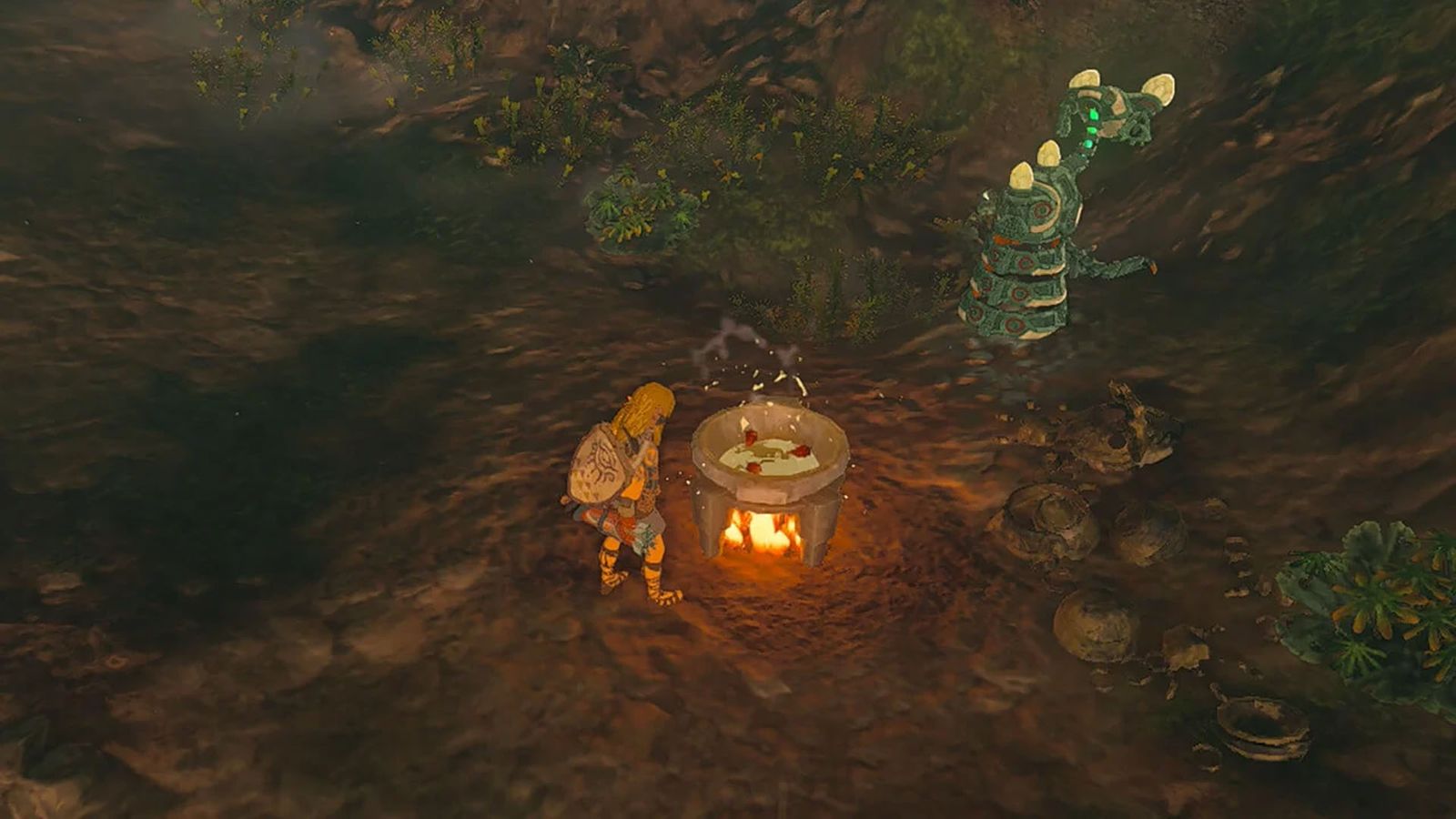 Screenshot of Zelda Tears of the Kingdom player using cooking pot with green plants nearby