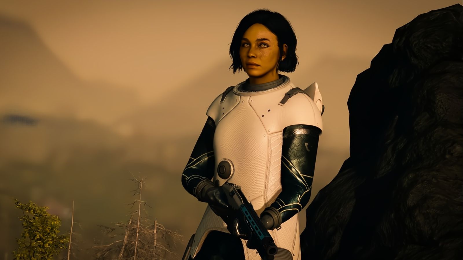 Starfield - woman holding a gun wearing white armour, looking at the camera