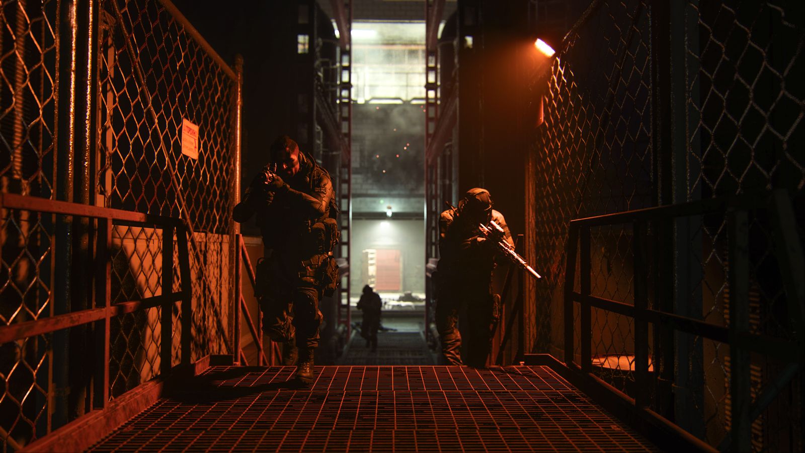 Screenshot of Modern Warfare 2 players holding guns and moving through corridor lit by dim red light