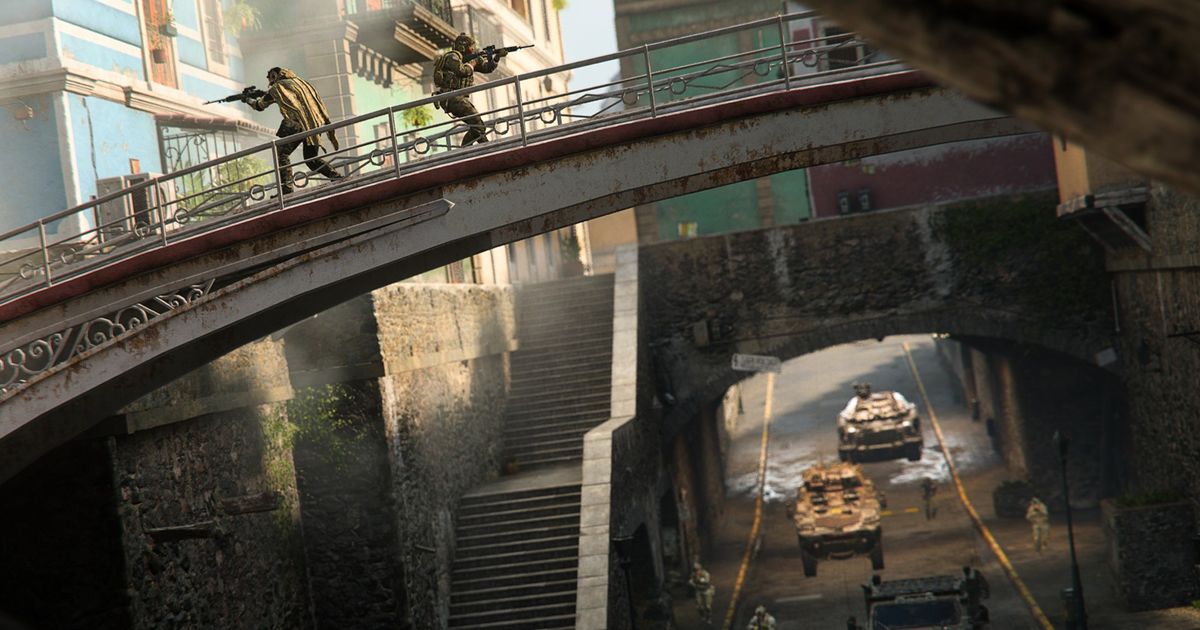 Warzone 2 players walking over bridge with tanks moving under bridge